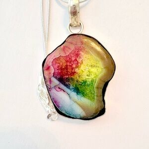 Beautiful, 2 inch, natural, Rainbow Solar Quartz pendant on a silver chain.